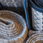 Different types of rugs rolled up