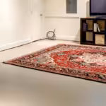 Finished basement with television and rug
