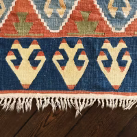 A rug with worn fringes in need of professional repair