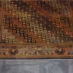 Red and orange Persian rug with intricate design
