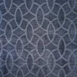 Closeup of geometric rug design featuring Pantone Color of the Year 2022, Very Peri, with design in light blue