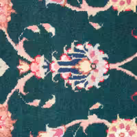 Green wool rug with colorful floral pattern treated with wool protection spray