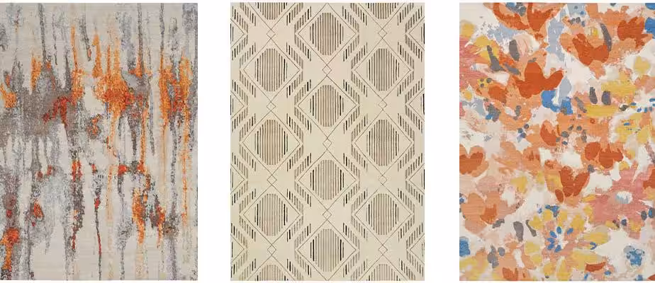 3 multicolored warm-tone Tibetan rugs spread out in a row