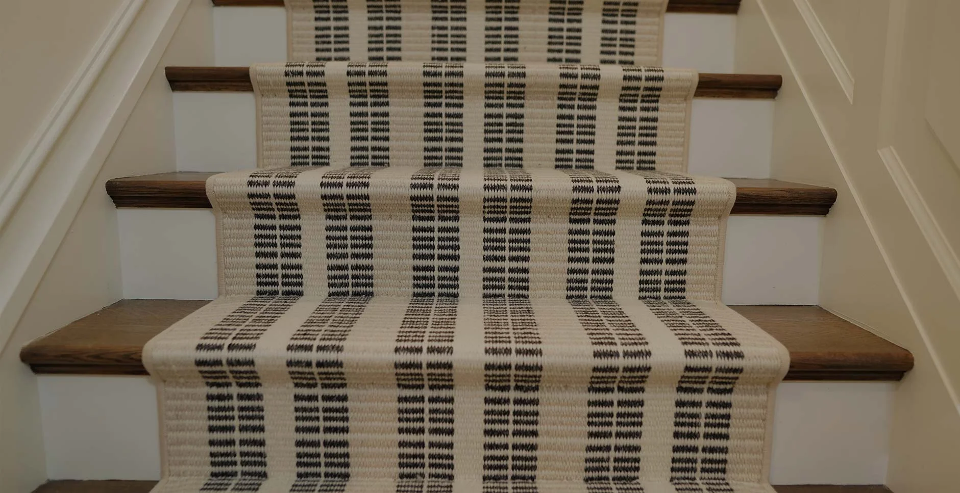 A close up of a custom stair runner